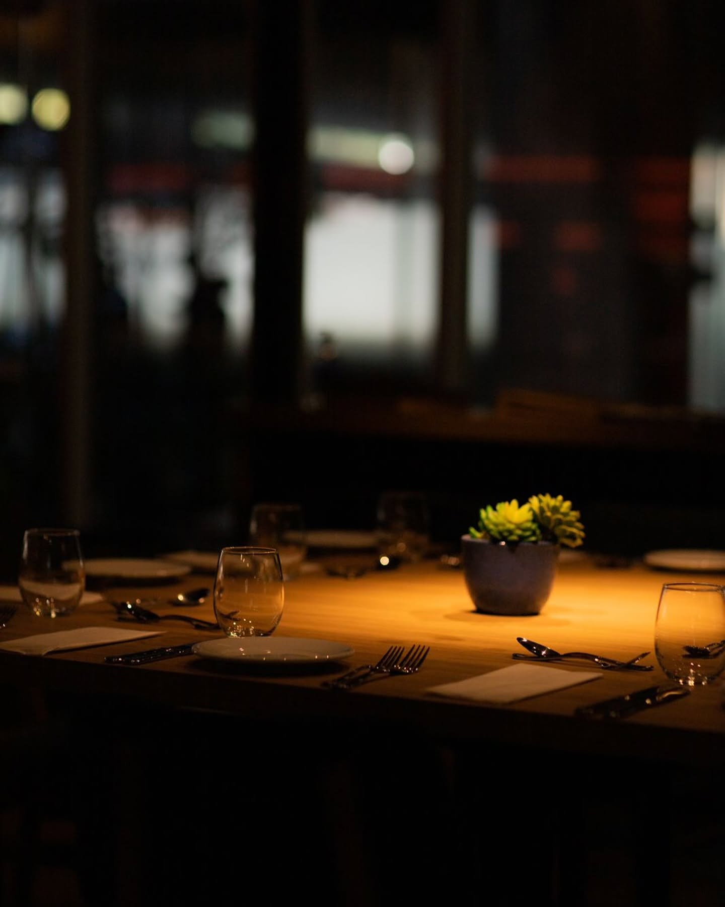 A candlelit table set for an intimate dinner
